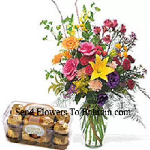 Bunte Blumen in einer Vase mit 16 Stück Ferrero Rocher